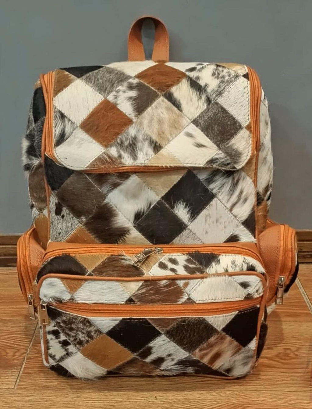 Genuine cowhide backpack with unique pattern, cowhide backpack front image.